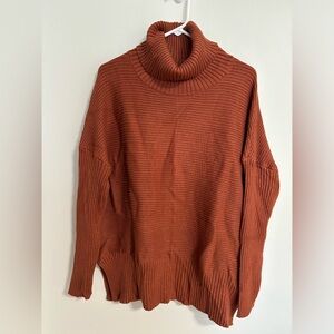rusty orange turtleneck long fit thick ribbed sweater
